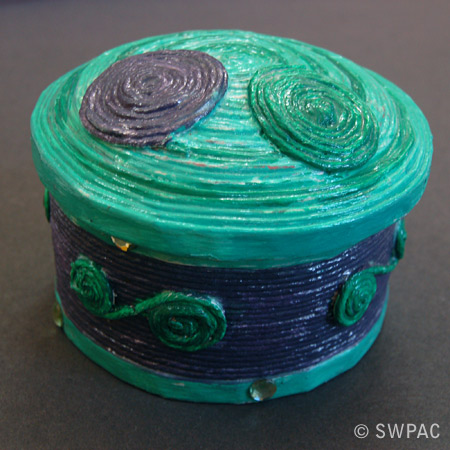 newspaper and string box by Sylvia